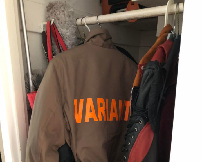 Variant jacket hanging on clothing rack